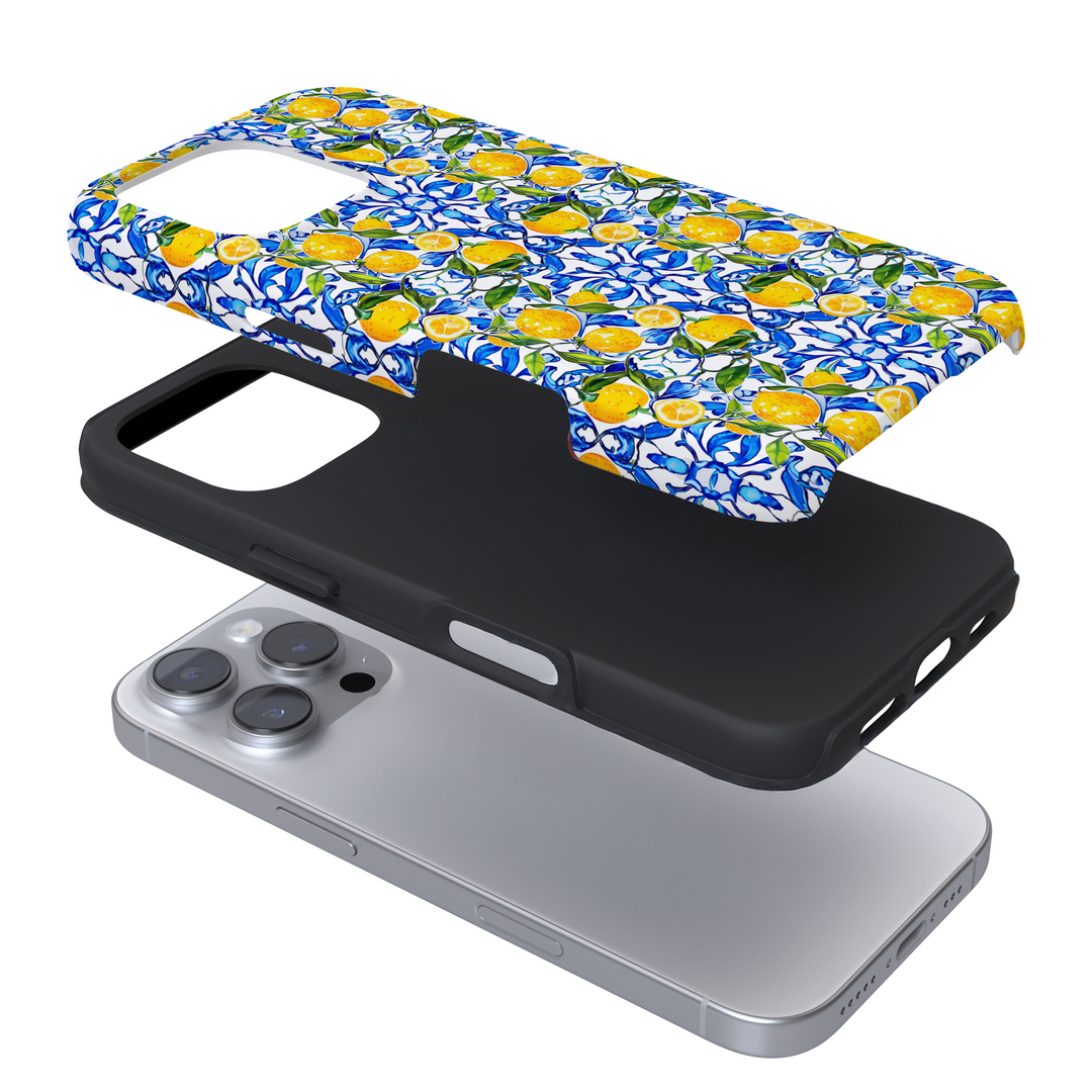 Expanded phone case with lemons and blue tiles on a white background