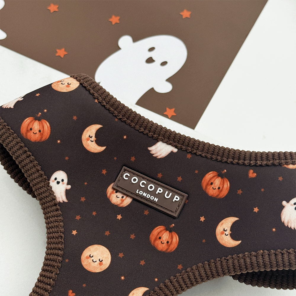 Brown dog harness with cute Halloween print featuring pumpkins, ghosts, and moons.