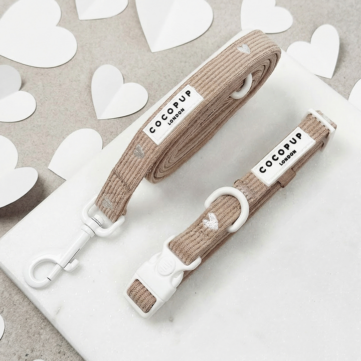 Dog Lead & Collar set in neutral brown shade with embroidered white hearts, with Cocopup branding.