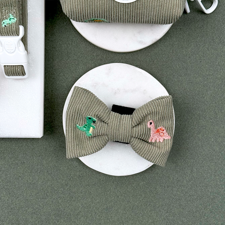 Green corduroy material Dog Bow Tie with embroidered dinosaurs. 