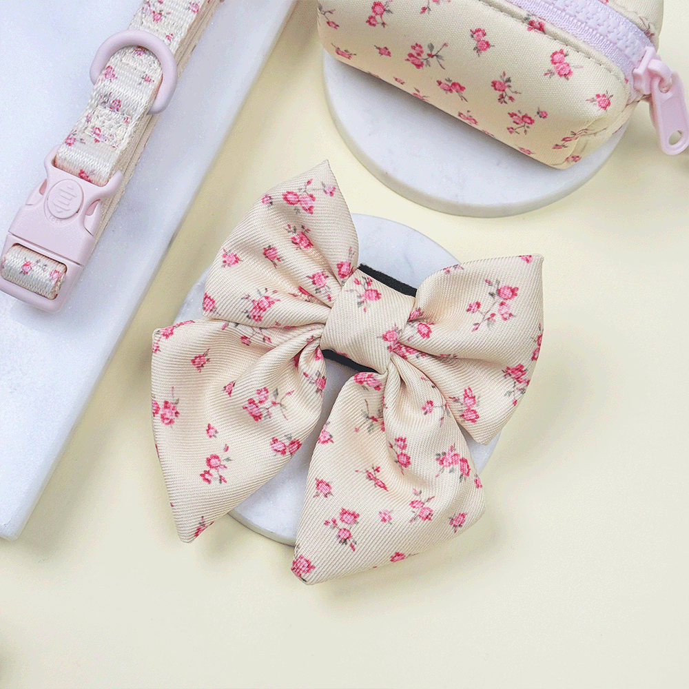 Floral Dog Sailor Bow Tie with yellow background and pink flowers.