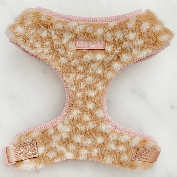 Faux fur dog harness in a beige and cream fawn pattern with pink ribbed trim and matching pink straps.