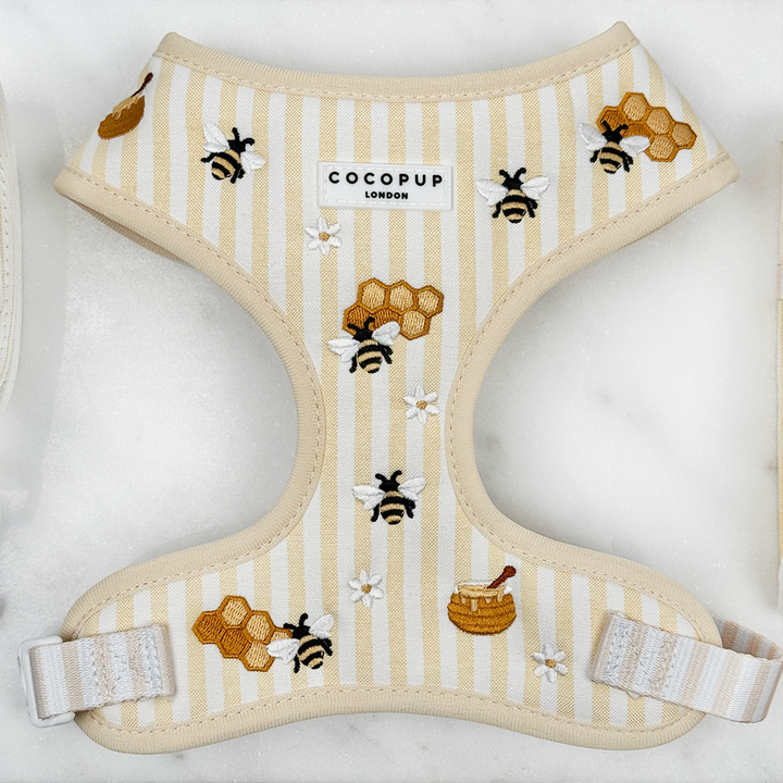 Pale yellow and white striped Dog Harness with bee and honeycomb embroidered decals. 