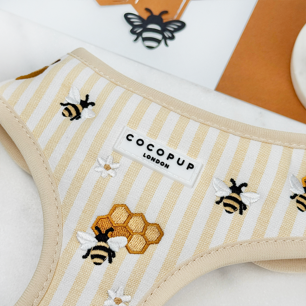 Pale yellow and white striped Dog Harness with bee and honeycomb embroidered decals. 